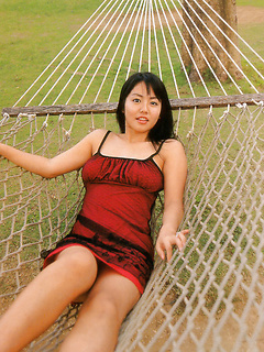 Sultry gravure idol tantilizes in her red bikini at the beach by AllGravure