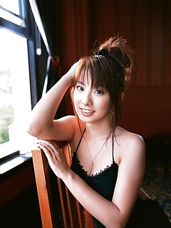 Tantilizing asian babe shows off her yummy curves in her dress by AllGravure