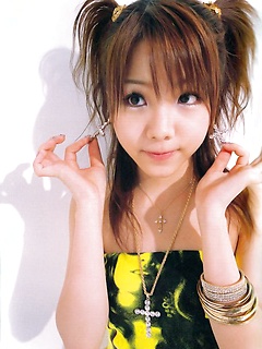 Heavenly gravure idol babe melts the heart in her yellow bikini by AllGravure