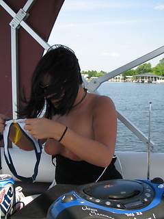 Bunch of girlfriends out on a boat drinking in skimpy bathing suits by Share My GF